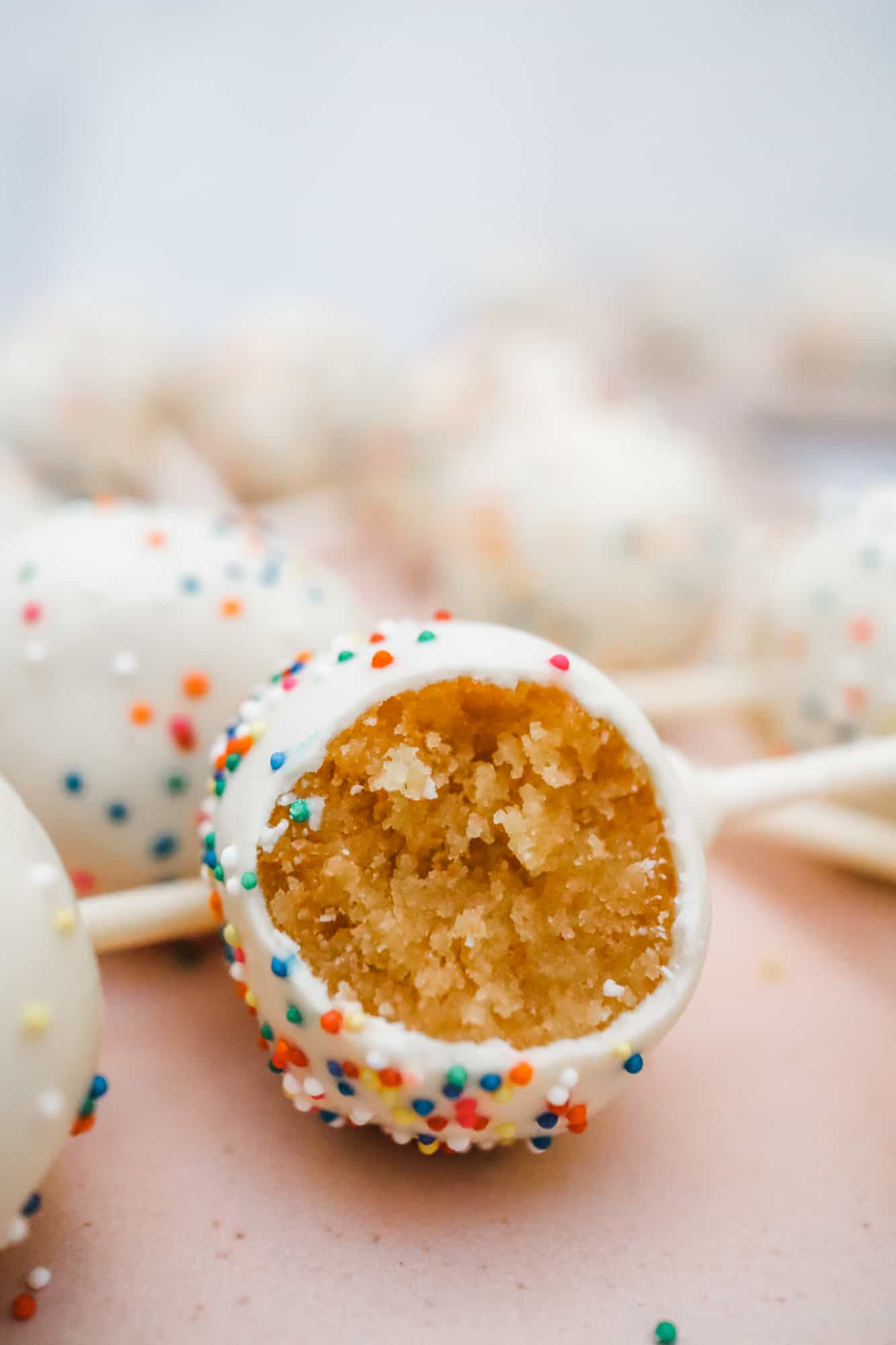 Cake Pop coated in Vanilla Candy Coating with Rainbow Sprinkles
