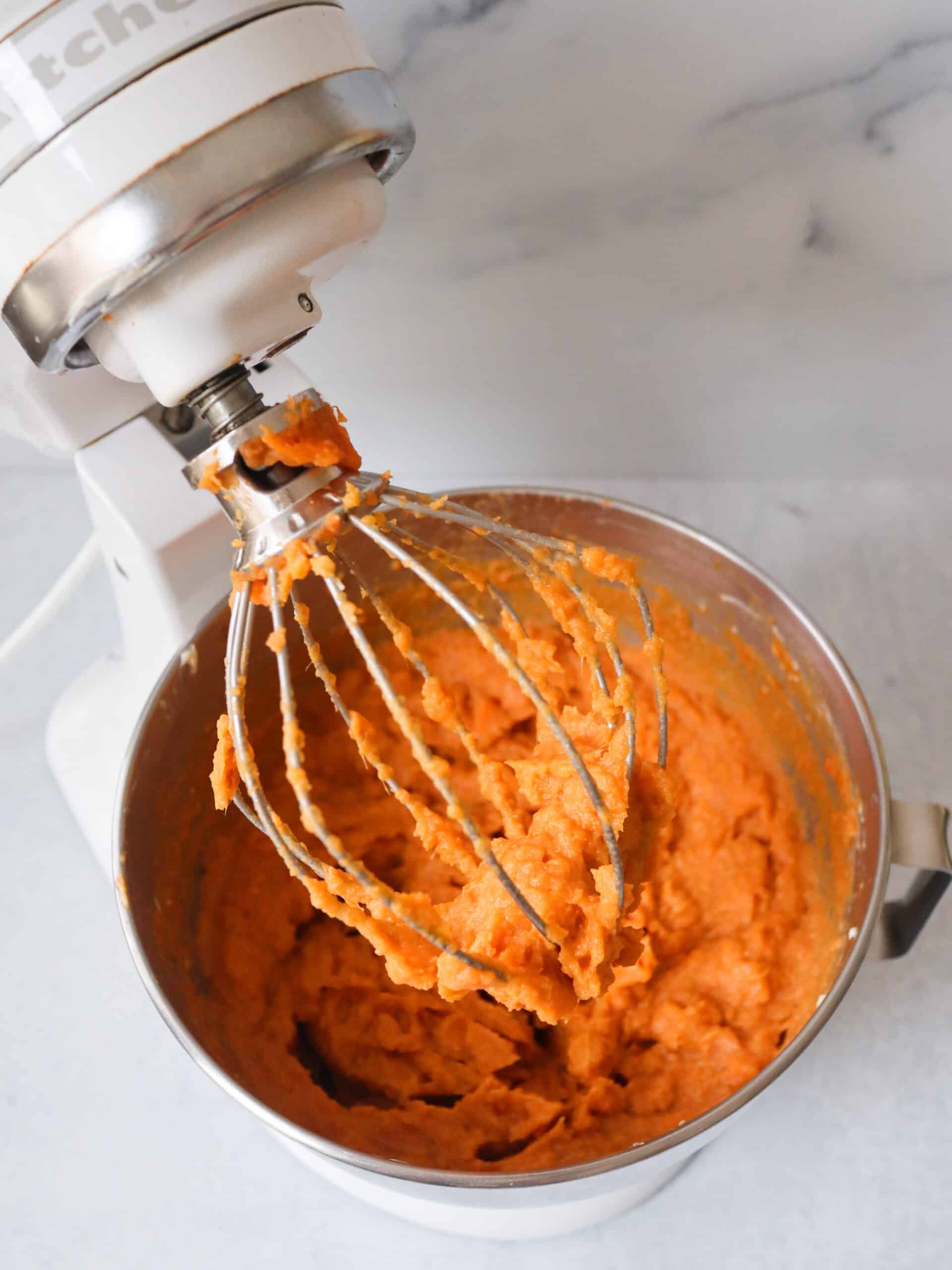 Sweet potato being whipped in a Kitchen Aid mixer