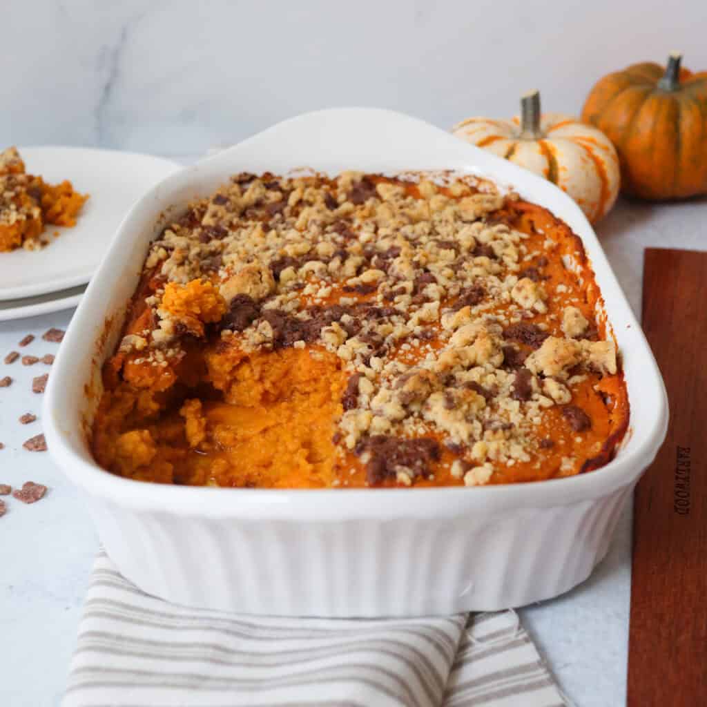 Sweet potato soufflé with pumpkins in the background