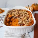 Sweet potato soufflé with pumpkins in the background