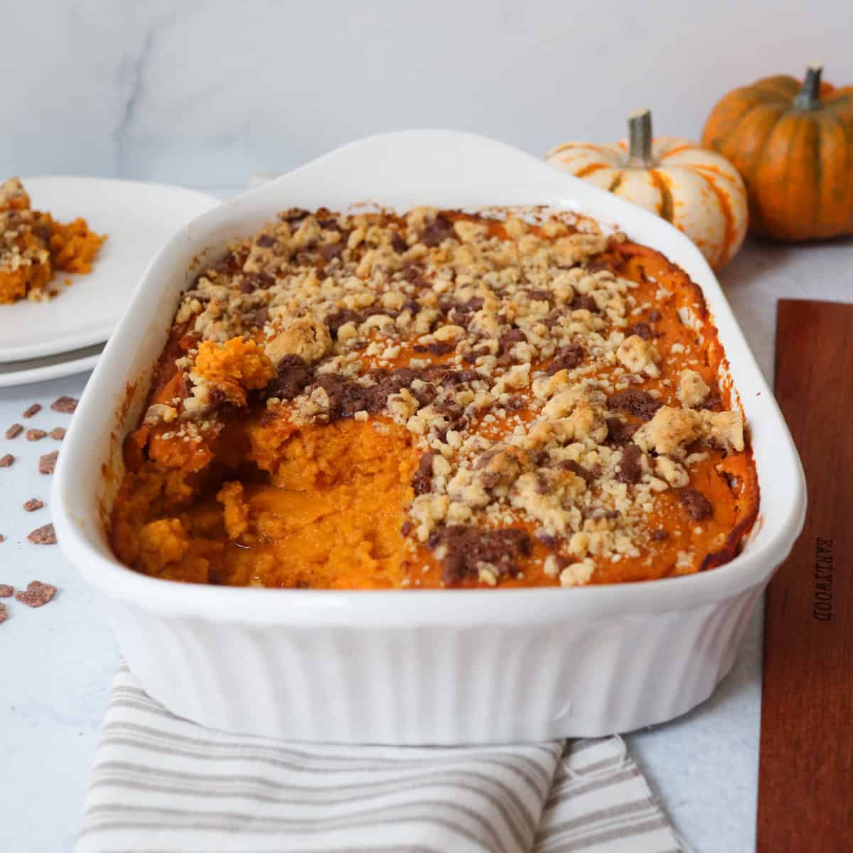 Sweet potato soufflé with pumpkins in the background