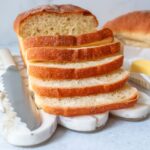 Homemade sandwich bread with knife and butter