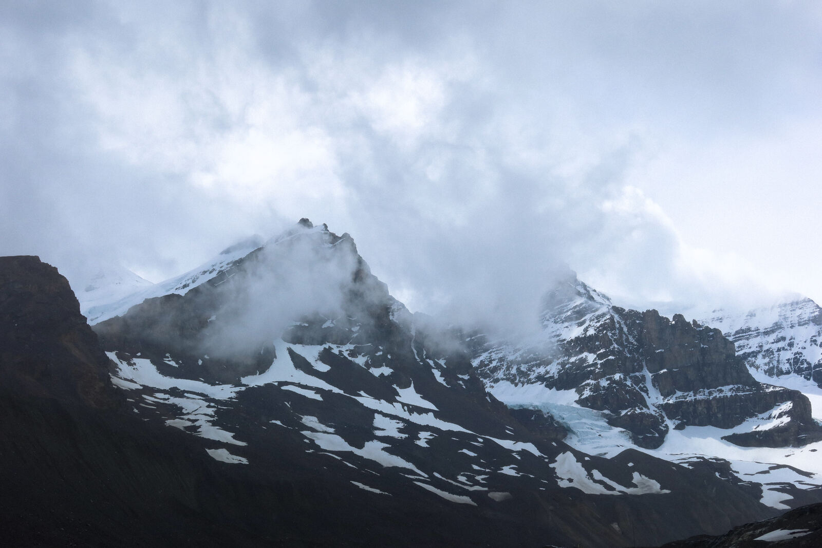 Clouds over the snow covered peaks at the Columbia Icefield